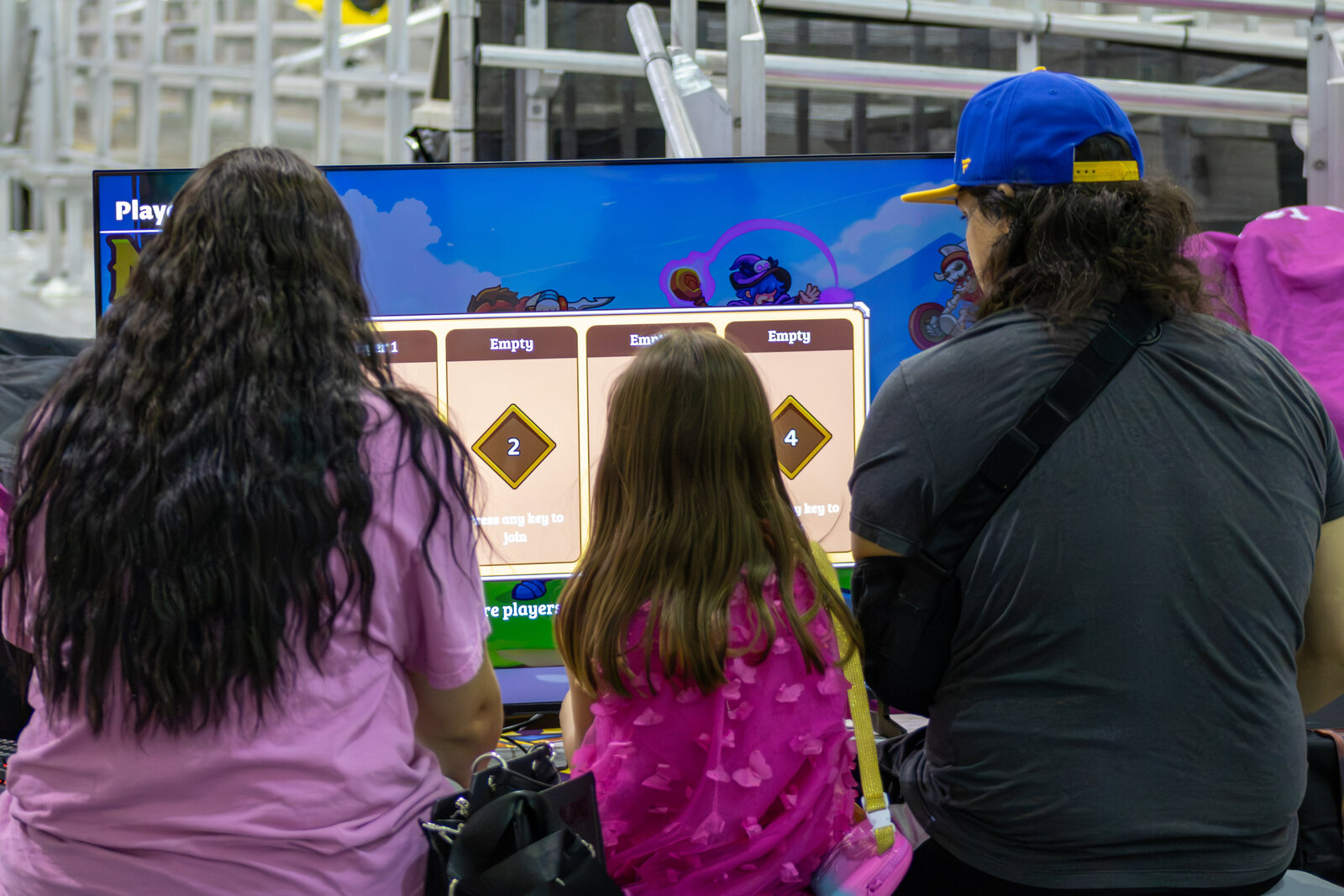 Attendees enjoying multiplayer gameplay at Garden State Comic Fest
